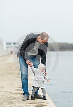 The father and the daughter walk.