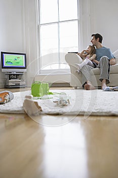 Father And Daughter Watching Television