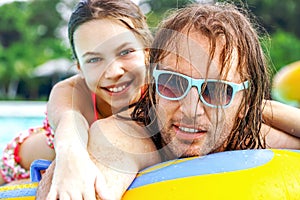 Father with daughter in water park
