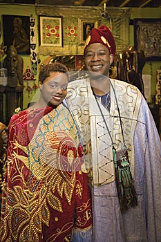 Father and daughter wearing African clot