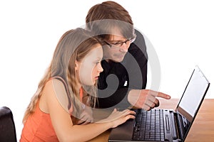 Father and daughter working on a laptop