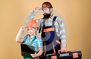 Father and daughter in workshop. Bearded man with little girl. construction worker assistant. Builder or carpenter
