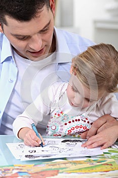 Father drawing with daughter