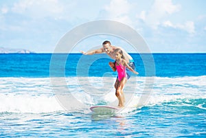 Father and Duaghter Surfing Together photo