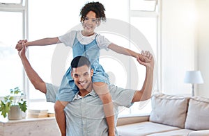 A father is every childs superhero. Portrait of a father carrying his little daughter on his shoulders at home.