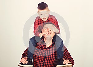 Father example of noble human. Best friends forever. Father little son red shirts family look outfit. Dad piggybacking