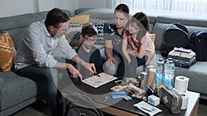 Father explaining to his family the emergency assembly point