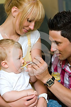 Father feeding a baby