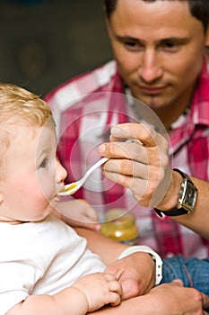 Father feeding baby