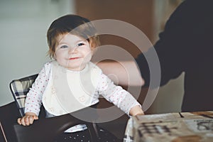 Father feeding baby girl from spoon mashed vegetables and puree. food, child, feeding and people concept -cute toddler