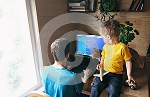 Father freelancer try work from home office, son child and cat hinder him, self- lifestyle workspace workplace photo