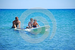 Father getting ready for stand up paddling