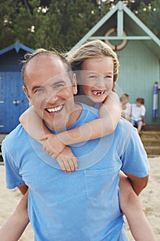 Father Giving Daughter Piggyback Ride