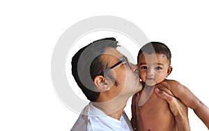 A father in glasses kissing a little boy on his lap in white background