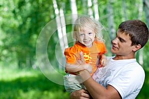 Father and happy son having fun outdoor