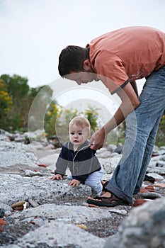 Father helping baby