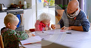 Father helping his daughter in drawing at home 4k