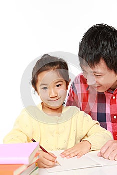 Father helping his daugther doing homework