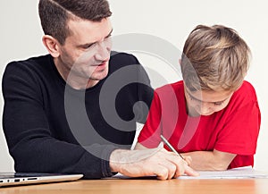 Father helping his son with homework