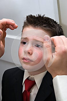 Father Helping Son Get Ready