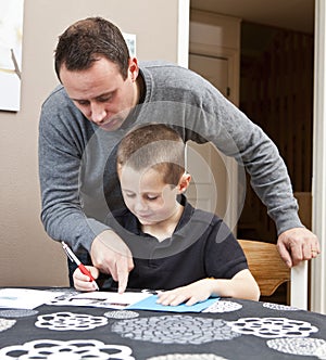 Father helping son with homework