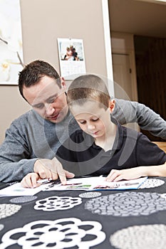 Father helping son with homework