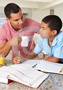 Father Helping Son With Homework