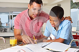 Father Helping Son With Homework