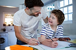 Father helping son with homework