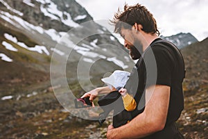 Father hiking with baby taking selfie by smartphone