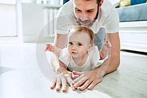 Father and his baby daughter at home