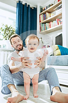 Father and his baby daughter at home