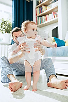 Father and his baby daughter at home