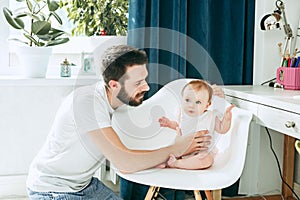 Father and his baby daughter at home