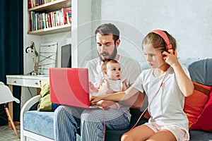 Father and his daughters at home