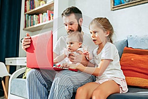 Father and his daughters at home