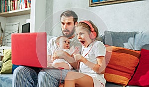 Father and his daughters at home