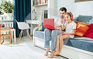 Father and his daughters at home