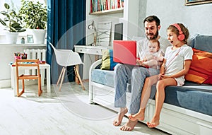 Father and his daughters at home