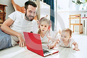 Father and his daughters at home