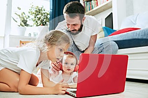 Father and his daughters at home