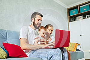 Father and his daughters at home