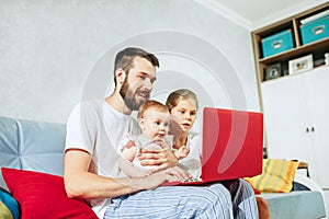 Father and his daughters at home