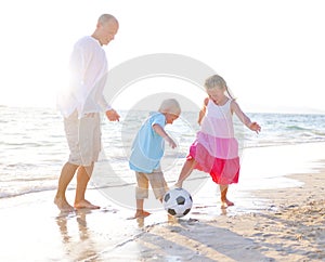 Father and his kids playing football together