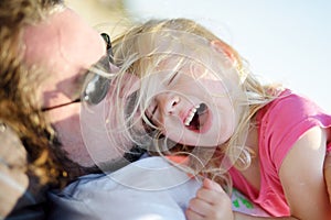 Father and his little daughter having fun together