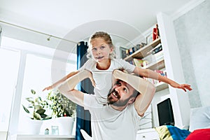 Father and his six years kid girl at home