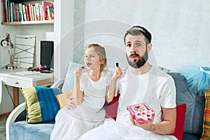 Father and his six years kid girl at home