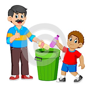 Father and his son collecting Rubbish plastic bottle
