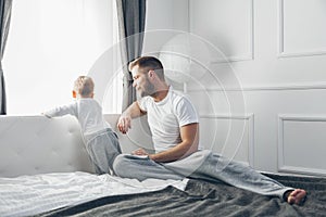 Father with his son looking out of the window