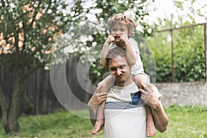 Father and his son playing and hugging in outdoors. Concept of Father`s day.